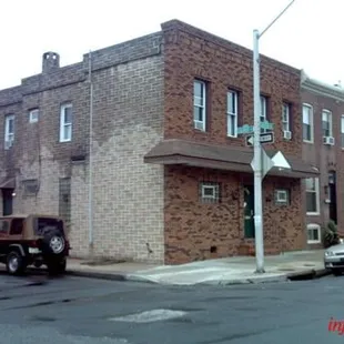 a truck parked in front of a brick building