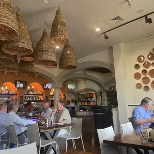Indoor dining area with salsa bar and bar