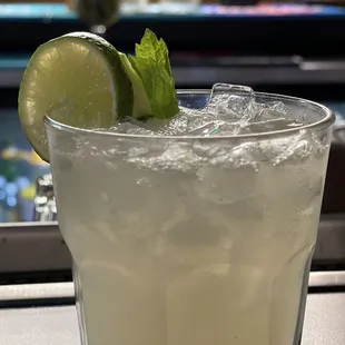 a margarita with a lime garnish