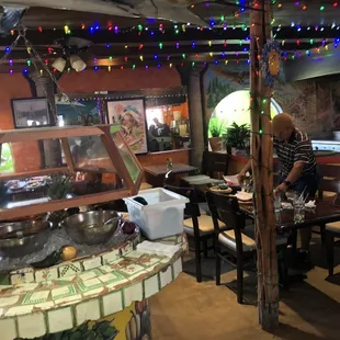 a woman preparing food in a restaurant