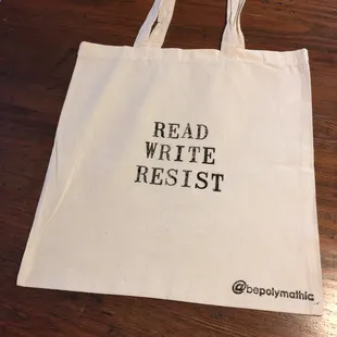 Customized social-message book bags like our Read-Write-Resist bag. Use for shopping or as a gift bag.