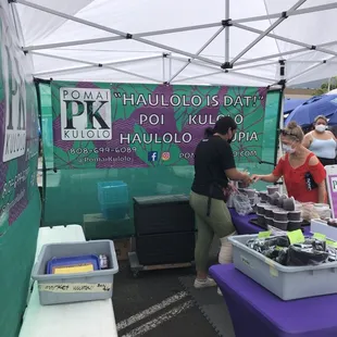 two people at a booth