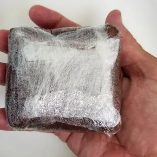 Pomai Kulolo is hand-wrapped tightly in plasic