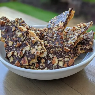 Matzo brittle! Dark chocolate, roasted almonds, candied tangelo, maldon sea salt.