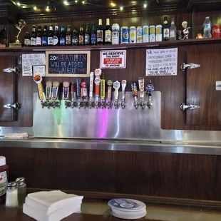 a bar with a variety of beer taps