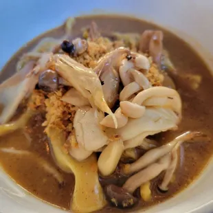 Ugly mushroom filled pasta, trumpets, shared cultures celery root miso butter sauce!
