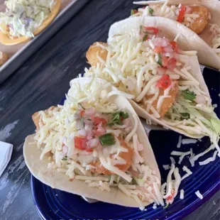 Crispy fish tacos, hickory beans, pulled pork and slaw