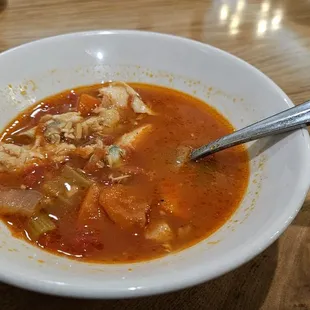 a bowl of soup with a spoon