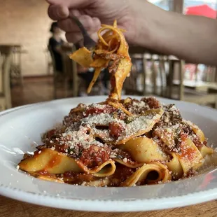 a plate of pasta with a fork