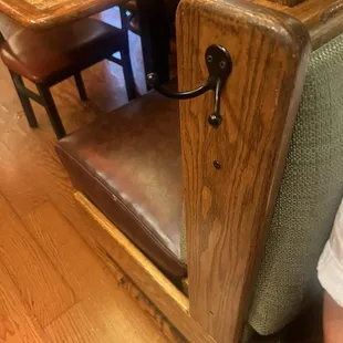 Purse hooks ends of booth