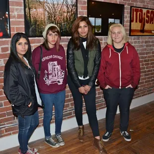 A group of art-loving teenagers at the "She Will Evaporate" show by photographer Alexandra Godoy...at LOFTon2nd.com