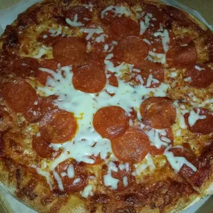 An example of them correcting their mistake of not adding extra cheese and pepperoni by slapping some on a finished pizza