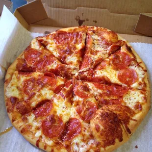 a pepperoni pizza in a box