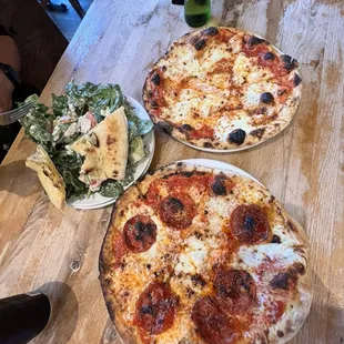 Hot honey pizza, classic pizza, and small salad