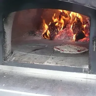 Cooking fresh pizza, the old fashion way!!!!!!