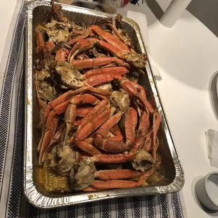 a pan of crab legs on a table