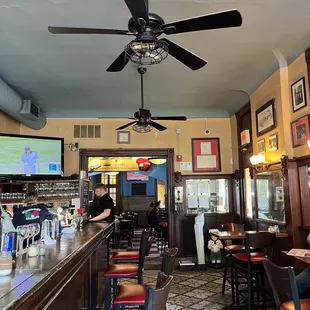 a bar with a ceiling fan