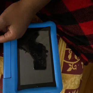 a person holding a tablet computer