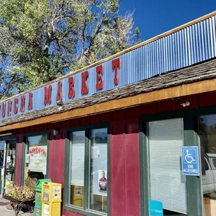 The Tesla SuperChargers are not at the Gas Station &amp; General Store, but 150 yards away.