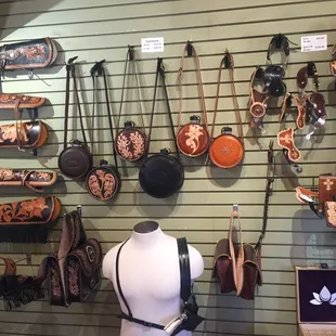 Spur straps, canteens, saddle bags, and wallets.