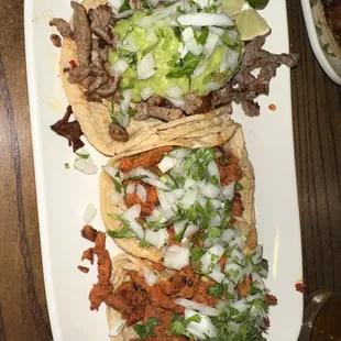 Taco Tuesday tacos. Carne asada and adobada. Both good but the adobada is way better.