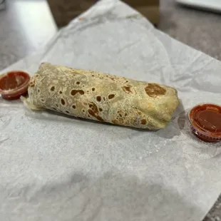 Eggs, cheese, potatoes, as requested a slight layer of beans, guacamole, sour cream, and a side of their hottest salsa.