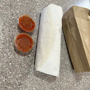 Eggs, cheese, potatoes, as requested a slight layer of beans, guacamole, sour cream, and a side of their hottest salsa.