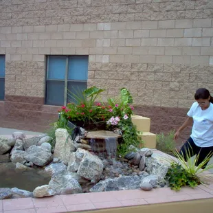 Small pond built in an inner courtyard at Tombaugh Elementary School Under the Ponds for Kids program.