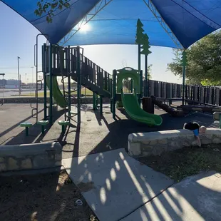Great toddler park.   Climbing, swings, slides, and shaded +  Picnic tables to sit at under large oak trees.