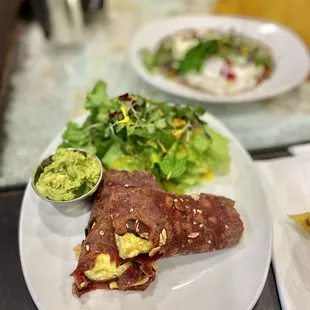 Almond roti Frankie ($10) - soft almond flour roti, scrambled eggs inside, and a spiced avocado mash.  The herb salad was derrishhhhh