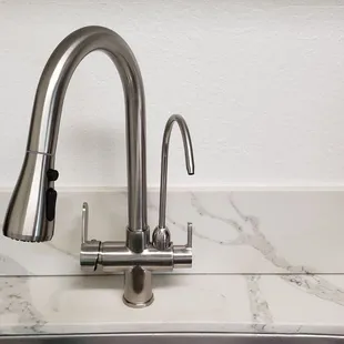 Optional pull-out faucet with a separate filtered water spigot.