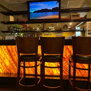 a bar with a television on the wall