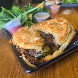 Cut into the Ponsonby Road Cafe Meat pie filled with steak, cheese, and jalapenos -  YUM!