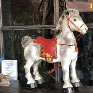 a horse with a red saddle