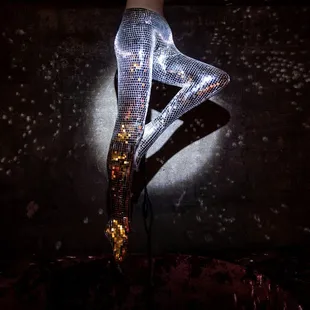 a woman's legs in shiny tights