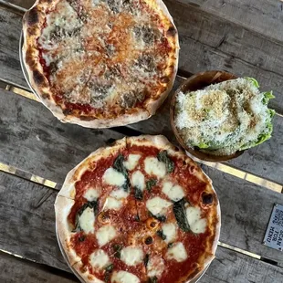 Cheese base with sausage, Classic Margarita, and the Caesar salad.