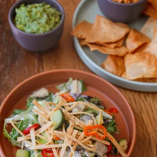 a salad with tortillas and guacamole