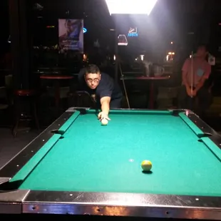 a man playing a game of pool