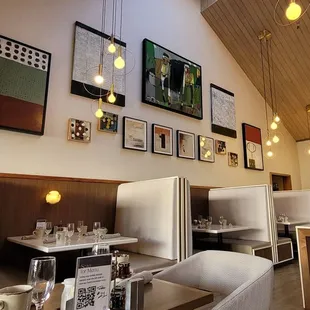 a dining area with tables and chairs