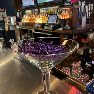 a martini glass filled with purple cabbage
