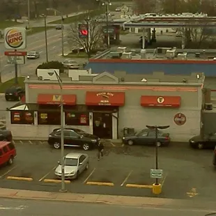 cars parked in front of a fast food restaurant