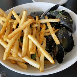 Mussels...order bread with them to soak up the garlic wine sauce!