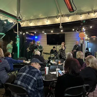 a group of people sitting around a table