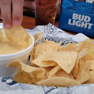 Chips and queso are not on the menu. So good I can't get a pick without a hand reaching.