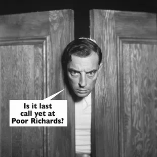 a man peeking through a door