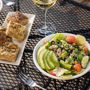 a plate of salad and bread