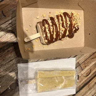  a popsicle and a box of food