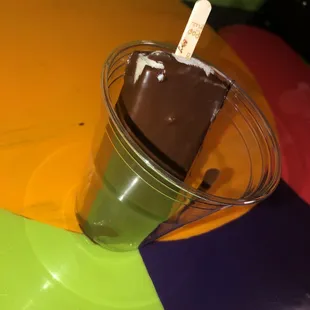 Arroz con leche paleta dipped in chocolate