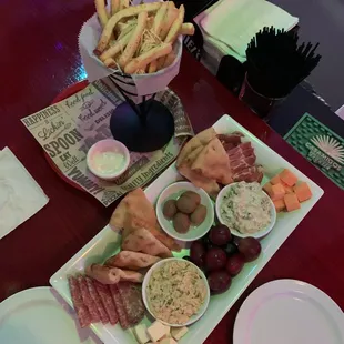 The POP Board: meats, cheeses, specialty olives, fruits, warm crunchy pita wedges, hummus and a Very Refreshing Spinach Dip.