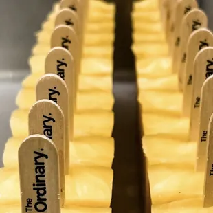  a row of pops with the name of the company on them